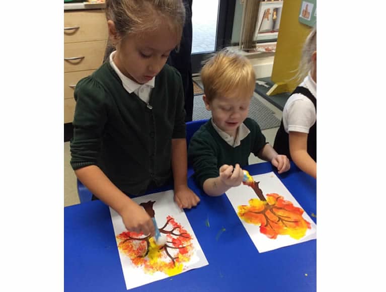 Pupils painting their trees 