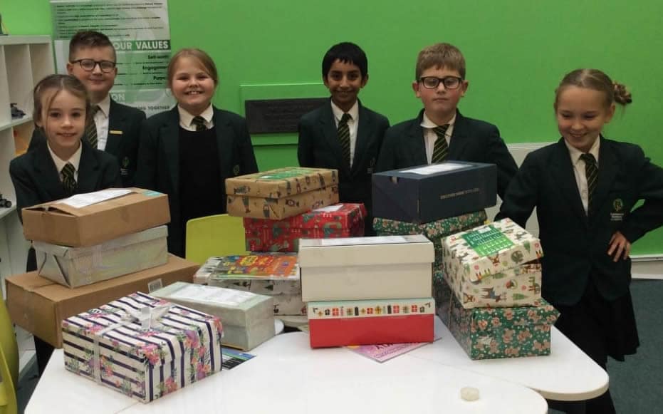 Pupils with Christmas boxes