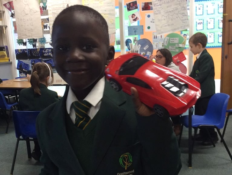 Pupil with toy car